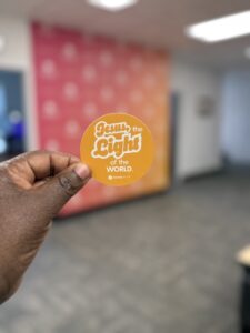 Image of person holding Jesus the Light of the World token