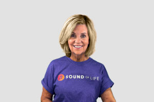Lisa in the new Sound of Life purple tee